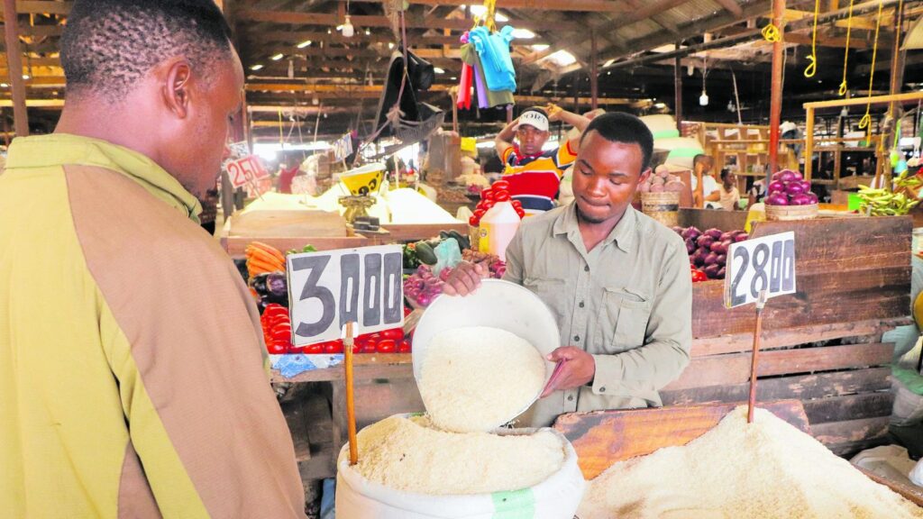An image showing a retailer selling a commodity to a consumer in Tanzania